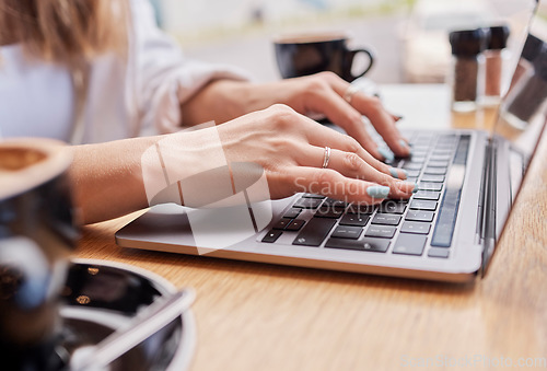 Image of Laptop, coffee shop and woman hands on keyboard typing for research, remote work and freelance career. Computer, business networking and worker in cafe working on internet, website and writing email