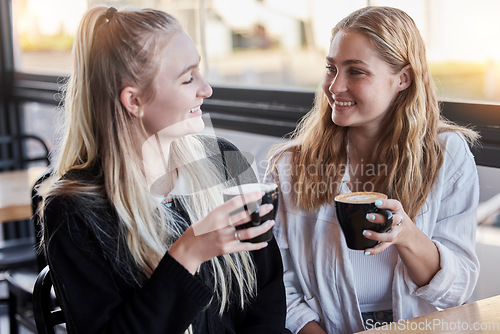 Image of Coffee shop, couple of friends and happy social date or conversation in morning for gen z lifestyle. Young people or youth women talking together with latte cup in cafe or restaurant on student break