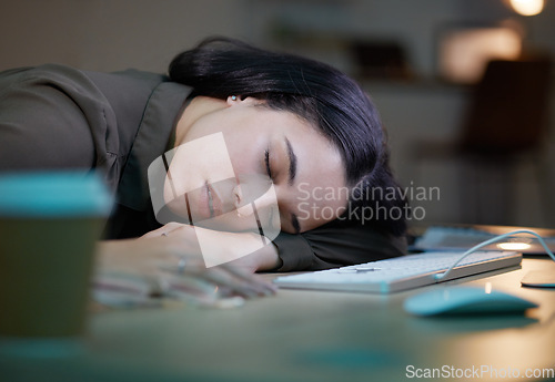 Image of Night, sleeping and tired woman on her desk computer with depression, burnout and mental health risk. Business person, workaholic or young employee fatigue, low energy and time management problem