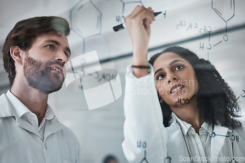 Image of Teamwork, science and chemistry with people writing in laboratory for medicine, pharmacy or healthcare. Research, analytics and medical with scientists solving on glass board for idea, study or data