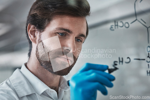 Image of Serious, science and chemistry with man writing in laboratory for medicine, pharmacy and healthcare. Research, analytics and medical with expert solving on glass board for idea, study and data