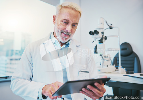 Image of Search, medical and ophthalmology with doctor and tablet for digital report, eye care and optical health. Medicine, technology and treatment with senior man in clinic for vision, optometry and check