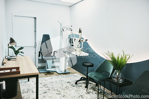 Image of Medical, ophthalmology and laser in empty room of clinic for eye exam, laser and consulting. Healthcare, technology and interior design with nobody and machine in office for optometry and medicine