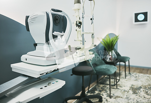 Image of Machine, ophthalmology and laser in empty room of clinic for eye exam, laser and consulting. Healthcare, technology and interior with nobody in medical office for optometry, medicine and appointment
