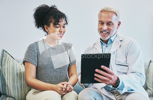 Image of Doctor, patient and man with tablet for consultation, checkup or health results in home visit. Healthcare, technology and senior medical professional with happy black woman for wellness appointment.