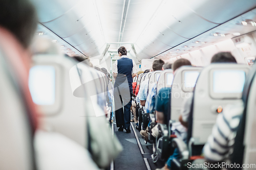 Image of Stewardess on the airplane.