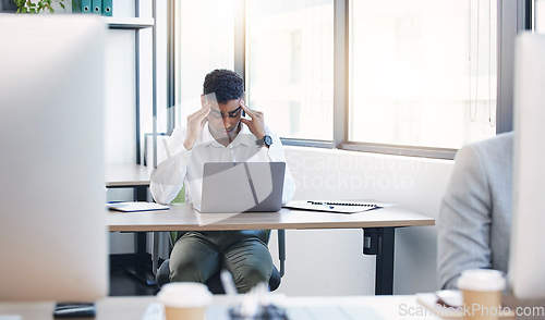 Image of Businessman, stress headache and laptop in office with burnout, anxiety and tired at desk with deadline. Young executive, frustrated or stressed at table with pc, 404 glitch or exhausted at workplace