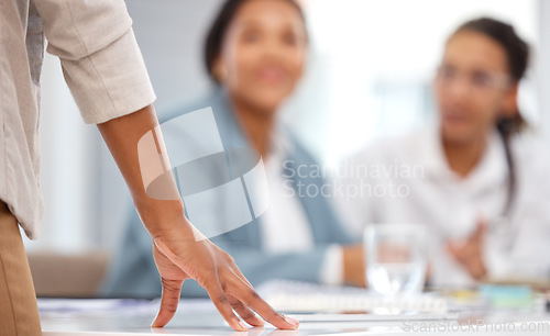 Image of Management, meeting and hand of black woman on desk for leadership, review and planning. Strategy, innovation and mentor with employee in corporate office for coaching, advisory and negotiation