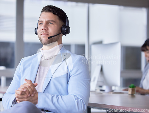 Image of Callcenter, focus or business man with microphone for customer support, consulting or networking in office. Thinking, CRM or focus sales advisor on tech for telemarketing, focus or telecom contact us