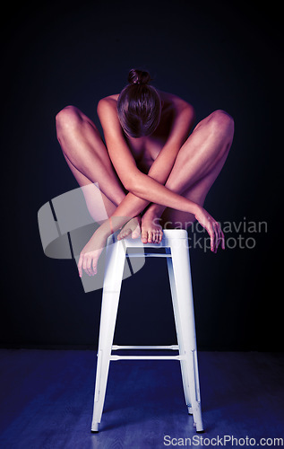 Image of Art, beauty and body of woman in studio for erotic, mystery and desire on black background space. Girl, chair and creative sitting, posing and gesture for expression, deco and mysterious aesthetic