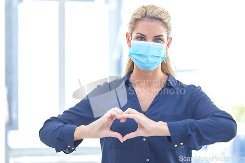 Image of Business, heart and portrait of a woman with covid, care and emoji for a pandemic at work. Healthcare, safety and corporate employee with a love hand gesture while wearing a face mask during corona