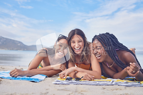 Image of Funny, happy and portrait with friends on beach for travel, diversity and summer break with blue sky mockup. Sunbathing, laugh and tropical with group of women on vacation for relax, freedom and sea