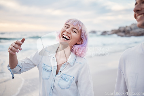 Image of Happy, beach and vacation with a couple walking on the sand together by the ocean or sea for fun. Smile, humor or joking with a woman and man enjoying a funny joke while bonding on the coast