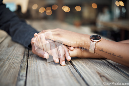 Image of Holding hands, couple zoom and restaurant date of black people together with trust and support. Hope, empathy and love of woman and man with compassion, gratitude and sympathy in a cafe with bokeh