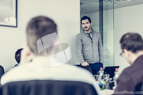 Image of Team leader making presentation on corporate business meeting.