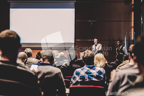 Image of Business speaker giving a talk at business conference meeting event.