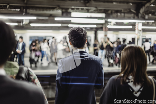 Image of Passengers traveling by Tokyo metro.