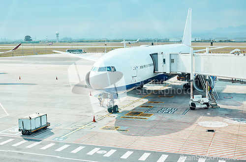 Image of Airplane, airport and runway near terminal and boarding steps for a flight for travel, logistics or commercial transport. Plane, aircraft and airline vehicle outdoors in Cape Town International
