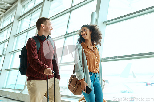 Image of Travel, love and smile with interracial couple in airport for vacation, tourism and departure. International trip, luggage and holiday with man and black woman walking for flight, journey or airline