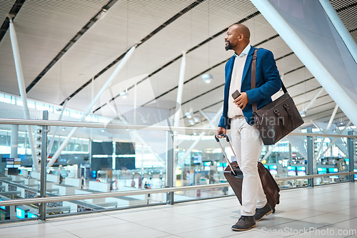 Image of Travel, airport and bag with a business black man walking in a terminal for global success. Manager, mockup and flight with a male ceo in a terminus station for international work traveling