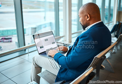 Image of Travel, laptop and serious with black man in airport for planning, vip lounge and communication. Relax, internet and technology with businessman reading email on layover for vacation, trip and flight