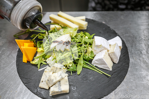 Image of The chef prepares the meal.