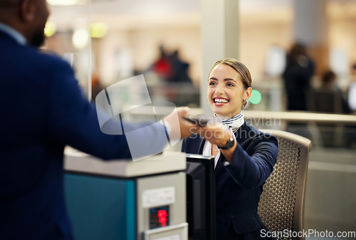 Image of Woman, airport and service agent with passport helping traveler for check in at terminal counter. Female passenger assistant with smile in travel security or immigration documents for airline control