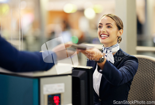 Image of Woman, airport and passenger assistant with passport helping traveler for check in at terminal counter. Female service agent with smile in travel security or immigration documents for airline control