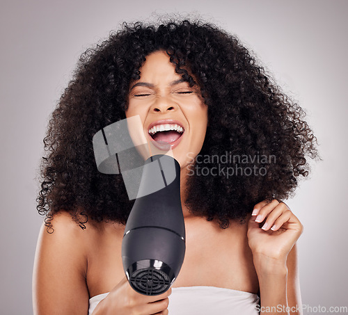 Image of Hair, blow dryer and black woman singing in studio for natural wellness, beauty and afro treatment. Hairdressing, luxury salon and comic, happy and face of girl with hairdryer for hairstyle grooming