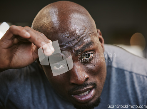 Image of Fitness, sweat and portrait of tired black man face in sports gym for exercise, workout and health goals. Motivation, sport and relax after intense training, healthy mindset, lifestyle and fatigue.