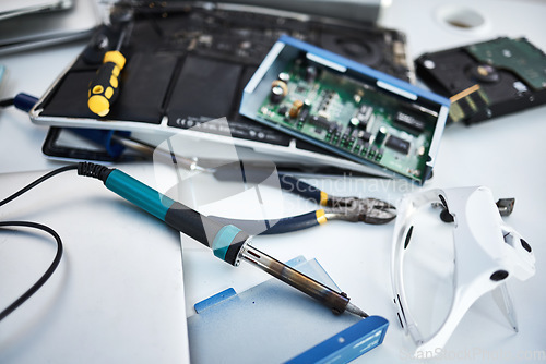 Image of Tools, computer hardware and equipment in the office for tech repairs, maintenance or upgrade. Database, technology and supplies for electric board servers on a desk in the it industry workplace.