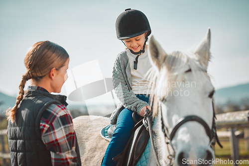 Image of Learning, hobby and girl on a horse with a woman for fun activity in the countryside of Italy. Happy, animal and teacher teaching a child horseback riding on a field as an equestrian sport in nature