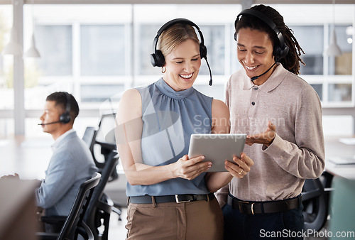 Image of Call center, customer support and consultants on a tablet in the office planning a crm strategy. Telemarketing, customer service and team of agents doing research on a mobile device in the workplace.