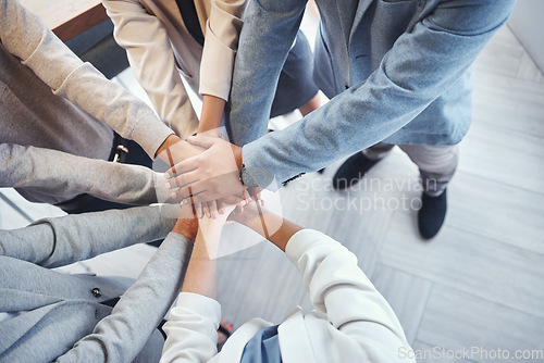 Image of Diversity, stack of hands and business people in the office in unity, collaboration and teamwork. Multiracial, corporate and professional team with motivation, support and connection in the workplace