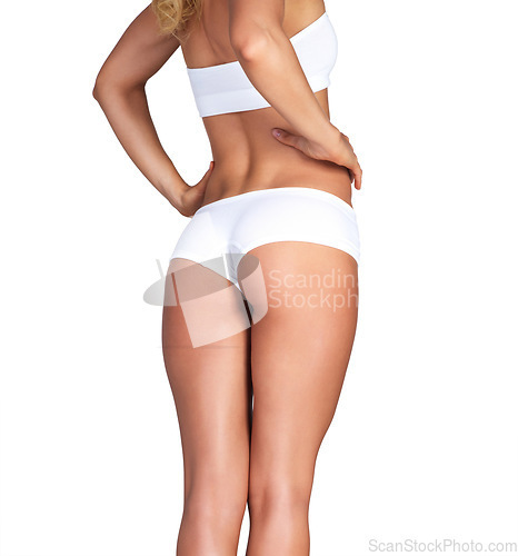 Image of Buttocks, body and underwear with a model woman in studio isolated on a white background for skincare. Bum, panties and legs with a female standing on blank mockup space to promote fitness or health