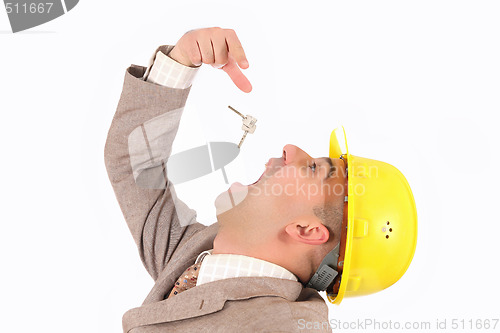 Image of A businessman engulf keys 