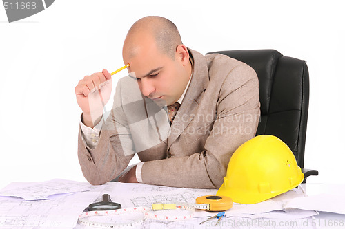 Image of Businessman thinking with architectural plans