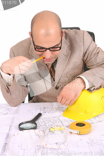 Image of Businessman thinking with architectural plans