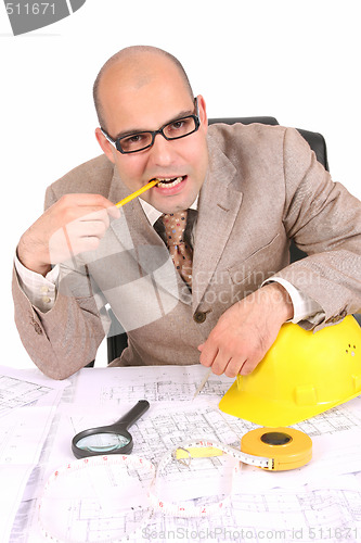 Image of Businessman thinking with architectural plans