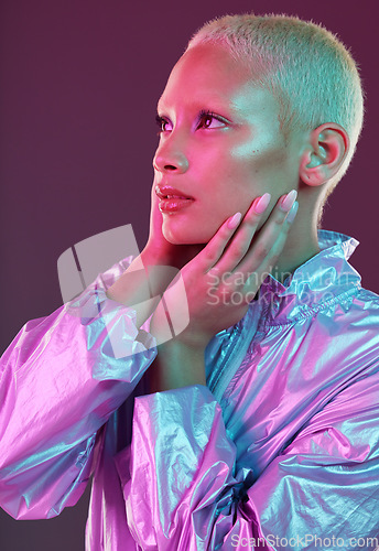 Image of Beauty, cyberpunk and fashion black woman with unique style, makeup and hairstyle isolated in a studio neon background. Creative, artistic and bright and colorful female is trendy and stylish