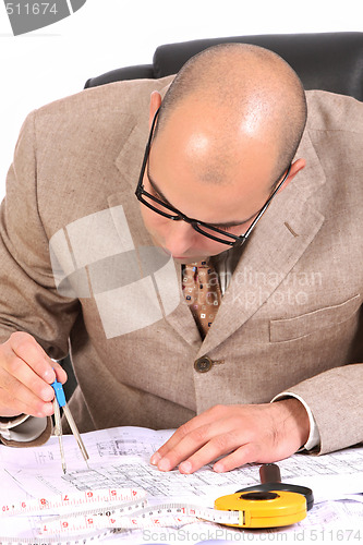 Image of Businessman with architectural plans 