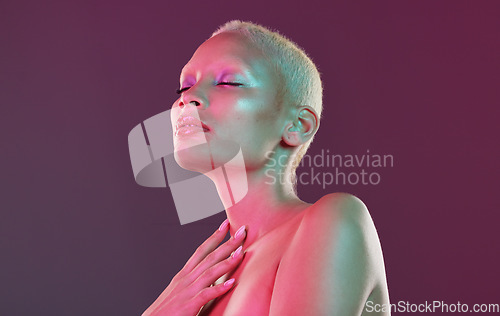 Image of Neon eyeshadow, beauty and art, woman with lights for creative skincare advertising on studio background. Cyberpunk, makeup product placement and model isolated for skin care and futuristic mockup.