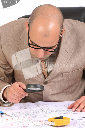 Image of Businessman with architectural plans 