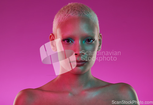 Image of Skincare, beauty and woman with neon face makeup and lights for creative advertising on pink background. Cyberpunk, product placement and model isolated for skin care and futuristic mock up in studio