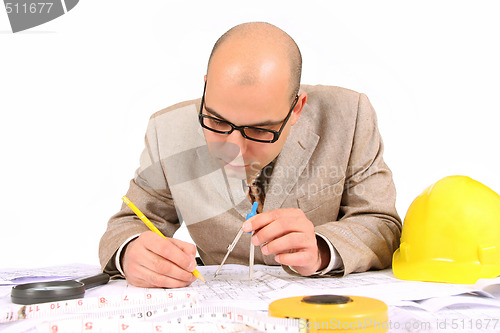 Image of Businessman with architectural plans 