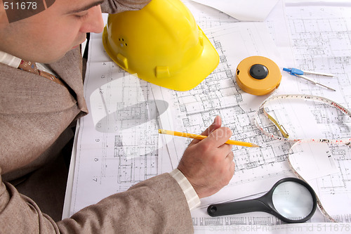 Image of Businessman with architectural plans 