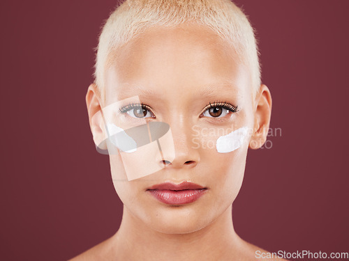 Image of Skincare, beauty and portrait of woman with lotion on face, cosmetics and skin product on studio background. Dermatology, facial treatment and model isolated with mock up, anti ageing care and glow