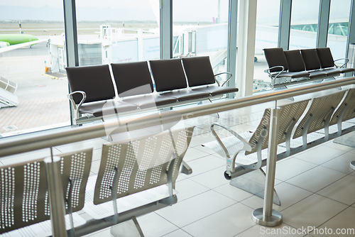 Image of Background of empty airport, terminal lounge and chair furniture in waiting room. Airplane lobby, seat and space of commercial flight, clean building interior and global travel design for journey