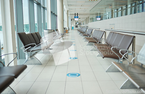 Image of Empty lounge space in airport with chair, waiting room and global travel of covid regulations. Immigration lobby, seat or building interior design for transportation, furniture and clean backgrounds