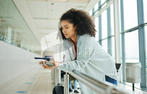 Image of Ticket, airport and passport of black woman for travel, global opportunity and transport time or schedule. UK person with smartphone and identity document in lobby for flight services and immigration